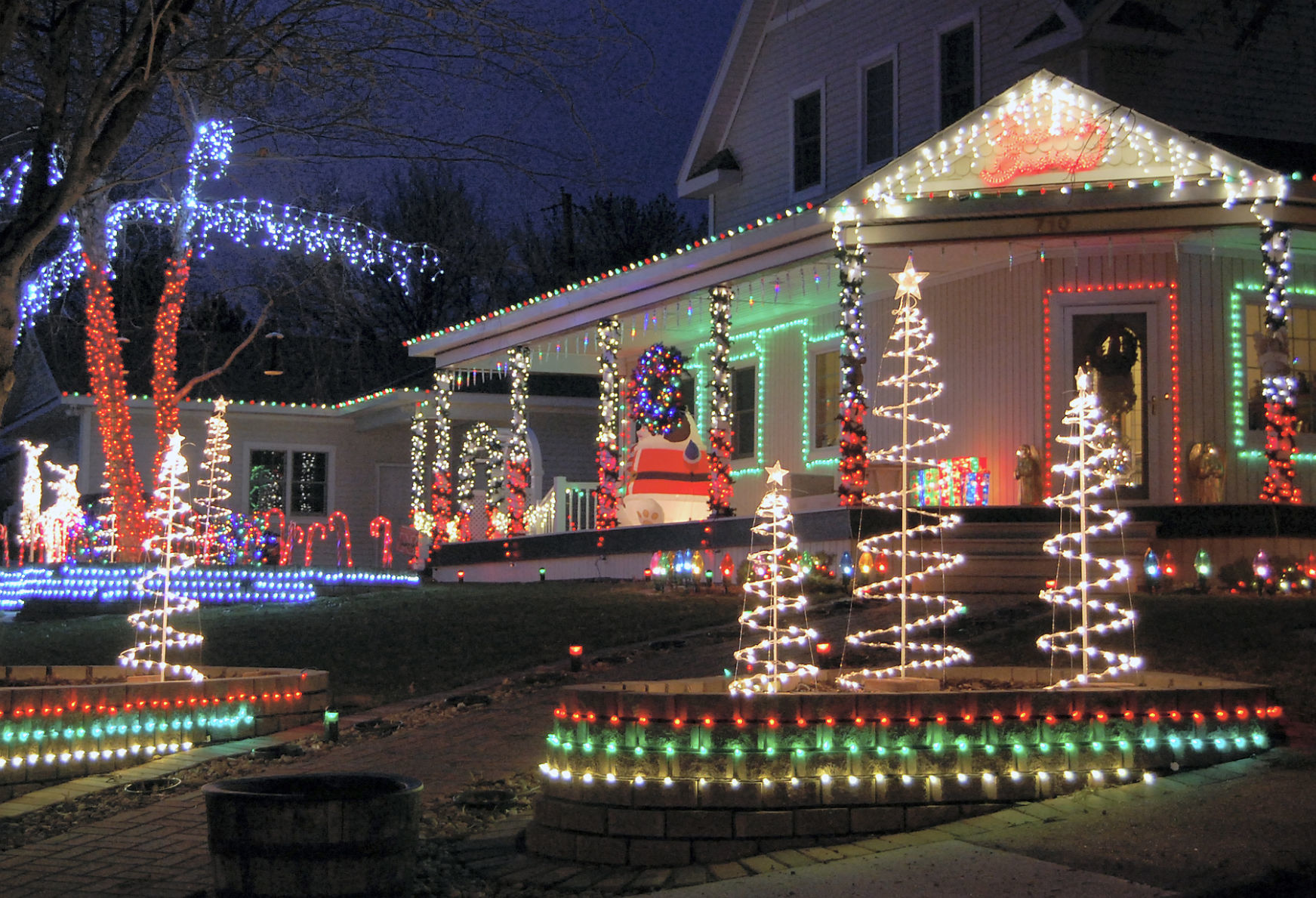 Dave and Jane Jensen’s house by Springfield Elementary School lights up the night with Christmas lights and decorations.
